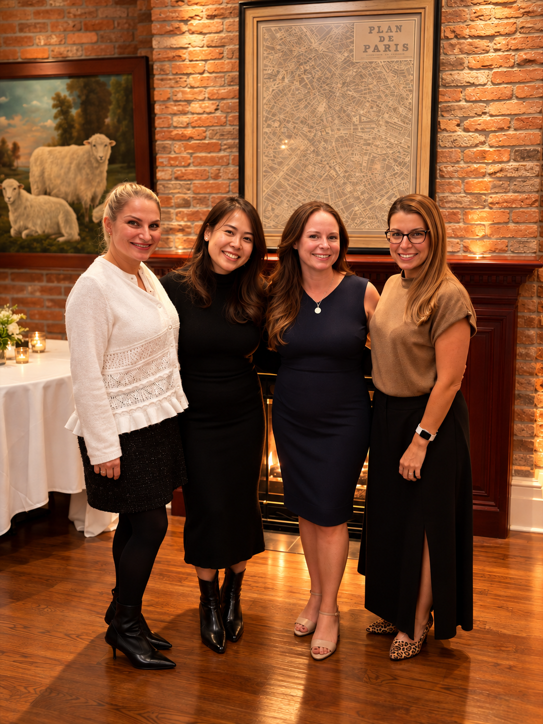 Four members of the CORY team together by the fireplace at a warm evening gathering